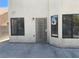 Exterior view of backyard, featuring a secure door and windows, ensuring safety and providing natural light at 8432 Apple Hill Ct, Las Vegas, NV 89128