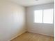 Clean bedroom with neutral carpet and a window providing natural light, showcasing simplicity at 8432 Apple Hill Ct, Las Vegas, NV 89128