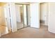 Bedroom with double mirrored closet doors offering space and functionality at 8432 Apple Hill Ct, Las Vegas, NV 89128