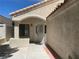 Covered entryway with security door and textured stucco walls at 8432 Apple Hill Ct, Las Vegas, NV 89128