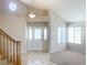 Bright entryway boasts tile flooring, a staircase, and ample natural light from large windows at 8432 Apple Hill Ct, Las Vegas, NV 89128