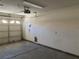 Spacious garage featuring a door and ample lighting for a functional and bright workspace at 8432 Apple Hill Ct, Las Vegas, NV 89128