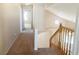 Hallway showcasing the staircase and access to other rooms with neutral paint throughout at 8432 Apple Hill Ct, Las Vegas, NV 89128