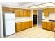Bright kitchen features tile flooring, lots of storage, and white appliances at 8432 Apple Hill Ct, Las Vegas, NV 89128