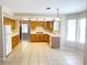 Well-lit kitchen features tile flooring, ample cabinet space, and modern appliances at 8432 Apple Hill Ct, Las Vegas, NV 89128