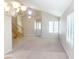 Open-concept living space with tile floors, and staircase at 8432 Apple Hill Ct, Las Vegas, NV 89128