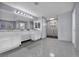 Elegant bathroom with marble floors, double vanity, and a glass-enclosed shower at 8809 Barium Rock Ave, Las Vegas, NV 89143