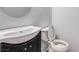 Close-up of an unfinished bathroom with a toilet and a black cabinet sink with an unfinished countertop at 8809 Barium Rock Ave, Las Vegas, NV 89143