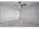 Bedroom with a ceiling fan and a door; blank canvas for new homeowner to transform at 8809 Barium Rock Ave, Las Vegas, NV 89143