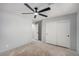 Bedroom with ceiling fan, double door closet, leading to another room, blank canvas for new homeowner at 8809 Barium Rock Ave, Las Vegas, NV 89143
