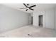 Bedroom with door leading to another room and ceiling fan; ready to transform at 8809 Barium Rock Ave, Las Vegas, NV 89143