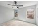 Light and airy bedroom featuring two windows and ceiling fan; ready to transform at 8809 Barium Rock Ave, Las Vegas, NV 89143
