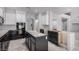Kitchen area with black and white cabinets, and a center island under construction at 8809 Barium Rock Ave, Las Vegas, NV 89143