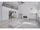 Spacious living room featuring an electric fireplace and tall ceilings at 8809 Barium Rock Ave, Las Vegas, NV 89143