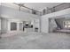 Open floor plan with kitchen and staircase in a home under construction at 8809 Barium Rock Ave, Las Vegas, NV 89143