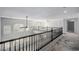 Bright and airy loft overlooking the living area, complete with large windows and modern ceiling fans at 8809 Barium Rock Ave, Las Vegas, NV 89143