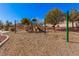 Community playground for with slides, climbing structures, and swing sets at 8809 Barium Rock Ave, Las Vegas, NV 89143