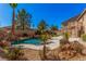 Beautiful backyard pool and spa surrounded by desert landscaping at 8809 Barium Rock Ave, Las Vegas, NV 89143