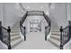 Elegant staircase leading to the upper level with decorative iron railings at 8809 Barium Rock Ave, Las Vegas, NV 89143