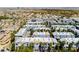 Aerial view of a Las Vegas community featuring colorful townhomes with desert landscaping and palm tree accents at 9050 W Tropicana Ave # 1102, Las Vegas, NV 89147