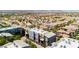 Neighborhood aerial view showcasing colorful townhomes nestled in a vibrant Las Vegas community with palm trees at 9050 W Tropicana Ave # 1102, Las Vegas, NV 89147
