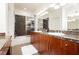 Bathroom features granite countertops, dual sinks, shower with glass door, and recessed lights at 9050 W Tropicana Ave # 1102, Las Vegas, NV 89147