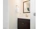 Half bathroom featuring modern fixtures, a stylish mirror, and fresh decor at 9050 W Tropicana Ave # 1102, Las Vegas, NV 89147