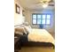 Comfortable bedroom with a ceiling fan and natural light from the window at 9050 W Tropicana Ave # 1102, Las Vegas, NV 89147