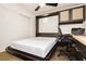Bedroom with murphy bed pulled down, cabinets and desk area perfect for working from home at 9050 W Tropicana Ave # 1102, Las Vegas, NV 89147