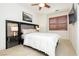 Stylish bedroom features plantation shutters, recessed lighting, and mounted television at 9050 W Tropicana Ave # 1102, Las Vegas, NV 89147