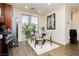 Bright dining area with modern table, large windows, and hardwood flooring at 9050 W Tropicana Ave # 1102, Las Vegas, NV 89147
