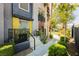 Beautiful walkway leading to front door, with an outdoor table and chairs at 9050 W Tropicana Ave # 1102, Las Vegas, NV 89147