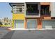 Modern townhome with colorful exterior, garages, and small balconies at 9050 W Tropicana Ave # 1102, Las Vegas, NV 89147
