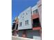 Multi-story townhome showcasing a modern architectural design and attached garages at 9050 W Tropicana Ave # 1102, Las Vegas, NV 89147