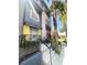 Multi-level home featuring a private front patio, colorful exterior, and desert landscaping at 9050 W Tropicana Ave # 1102, Las Vegas, NV 89147