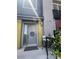 Inviting front entrance with gray door, a wreath, and seating area at 9050 W Tropicana Ave # 1102, Las Vegas, NV 89147