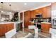 Stylish kitchen with stainless appliances, granite countertops, and wooden cabinets at 9050 W Tropicana Ave # 1102, Las Vegas, NV 89147
