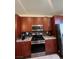 Well-equipped kitchen featuring stainless steel appliances and wooden cabinets at 9050 W Tropicana Ave # 1102, Las Vegas, NV 89147