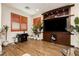 Cozy living room with built-in shelving, television, and stylish accents at 9050 W Tropicana Ave # 1102, Las Vegas, NV 89147