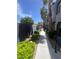 Community walkway and pathway lined with trees and manicured landscaping at 9050 W Tropicana Ave # 1102, Las Vegas, NV 89147