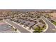 High aerial view of a neighborhood with similar styled homes situated in a desert community at 942 Shadow Hawk Rdg, Mesquite, NV 89027