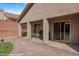 Backyard showcasing a covered patio and a putting green for leisure and entertainment at 942 Shadow Hawk Rdg, Mesquite, NV 89027