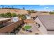 Secluded backyard oasis with a custom putting green, outdoor seating, and a built-in grill at 942 Shadow Hawk Rdg, Mesquite, NV 89027