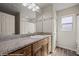 Bathroom with granite countertops, tile flooring, and bright natural light at 942 Shadow Hawk Rdg, Mesquite, NV 89027