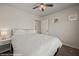 Bright bedroom featuring plush carpeting, fan, and natural lighting at 942 Shadow Hawk Rdg, Mesquite, NV 89027