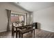 Bright dining area features wood-look tile flooring and a large window at 942 Shadow Hawk Rdg, Mesquite, NV 89027