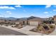 Beautiful single-story home with a large garage and desert landscaping at 942 Shadow Hawk Rdg, Mesquite, NV 89027