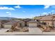 Charming single-story home with a well-maintained xeriscaped front yard and a two-car garage at 942 Shadow Hawk Rdg, Mesquite, NV 89027