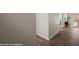 Inviting hallway with wood-look tile flooring leading to living area and outdoor view at 942 Shadow Hawk Rdg, Mesquite, NV 89027