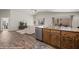 Spacious open-concept living area featuring wood-style tile flooring and natural light at 942 Shadow Hawk Rdg, Mesquite, NV 89027